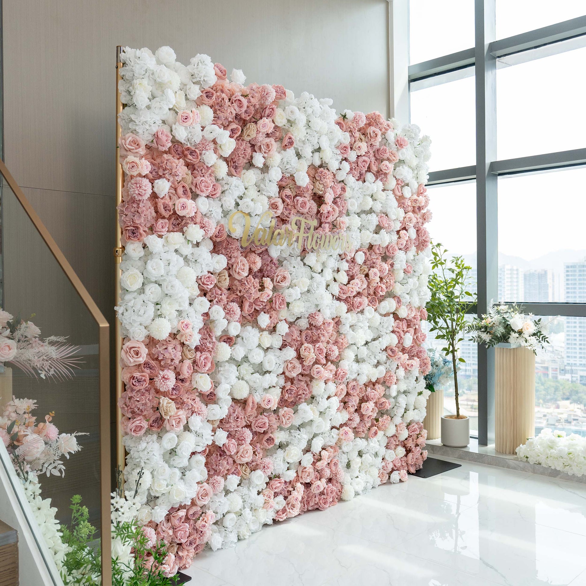 ValarFlowers' 2.4x2.4m floral wall showcases a lush arrangement of white and soft - pink roses and hydrangeas, making an elegant event backdrop. 