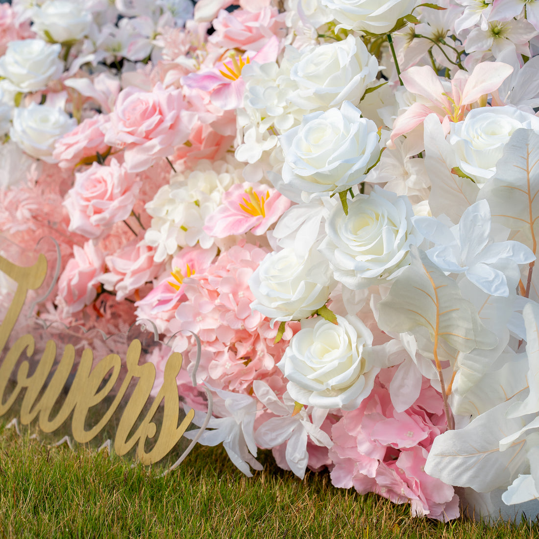 This backdrop showcases a rich arrangement of artificial flowers. It prominently features white and pink roses, along with large - petaled pink hydrangeas and white decorative leaves. The color palette combines soft pinks and pure whites, creating a romantic and elegant style, ideal for wedding or bridal - themed events. 