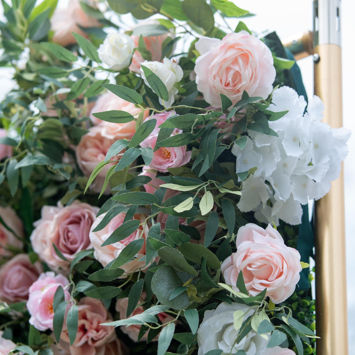 This photo features a lush arrangement of pink and white roses, along with white hydrangeas, interspersed among green foliage. The soft, pastel - colored blooms create a romantic and elegant atmosphere. Ideal for events like anniversary dinners or a "Floral Elegance Gala", it combines the charm of roses with the fullness of hydrangeas, making it perfect for refined and celebratory occasions. 