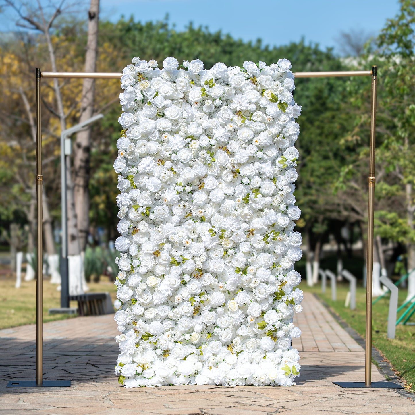 This backdrop features a metal - framed structure adorned with a dense arrangement of artificial white flowers, including roses and other blooms, interspersed with green leaves. The all - white color scheme exudes elegance.

It is suitable for weddings, symbolizing purity and new beginnings; bridal and baby showers, adding a delicate and celebratory touch; and corporate events, providing a sophisticated and refined atmosphere. 