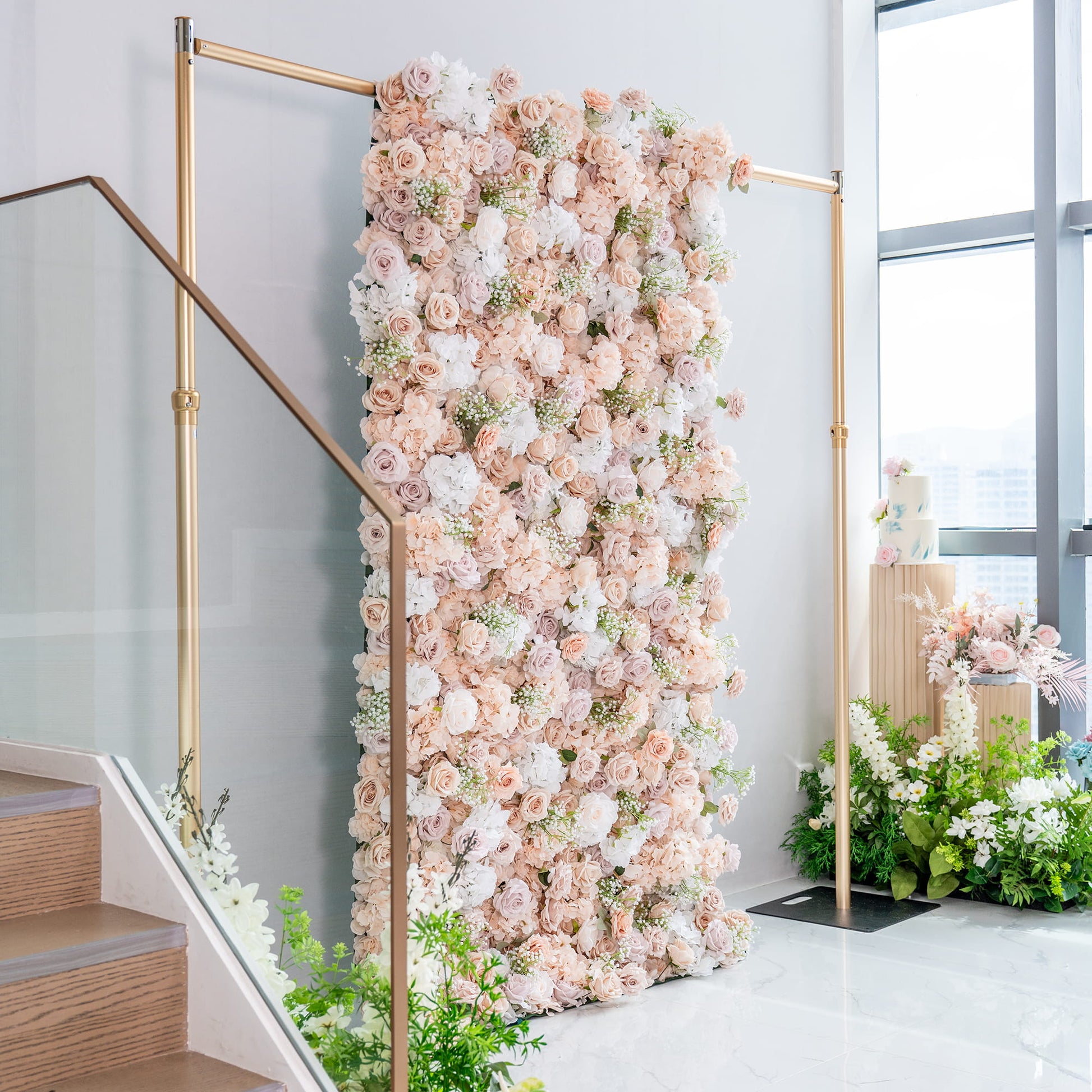This floral backdrop, supported by a gold - toned metal frame, is a lush arrangement. It features artificial roses in soft shades of blush, cream, and pale pink, interspersed with white hydrangeas and delicate baby's - breath - like greenery. The color palette is gentle and romantic, creating an elegant style ideal for events such as weddings. 