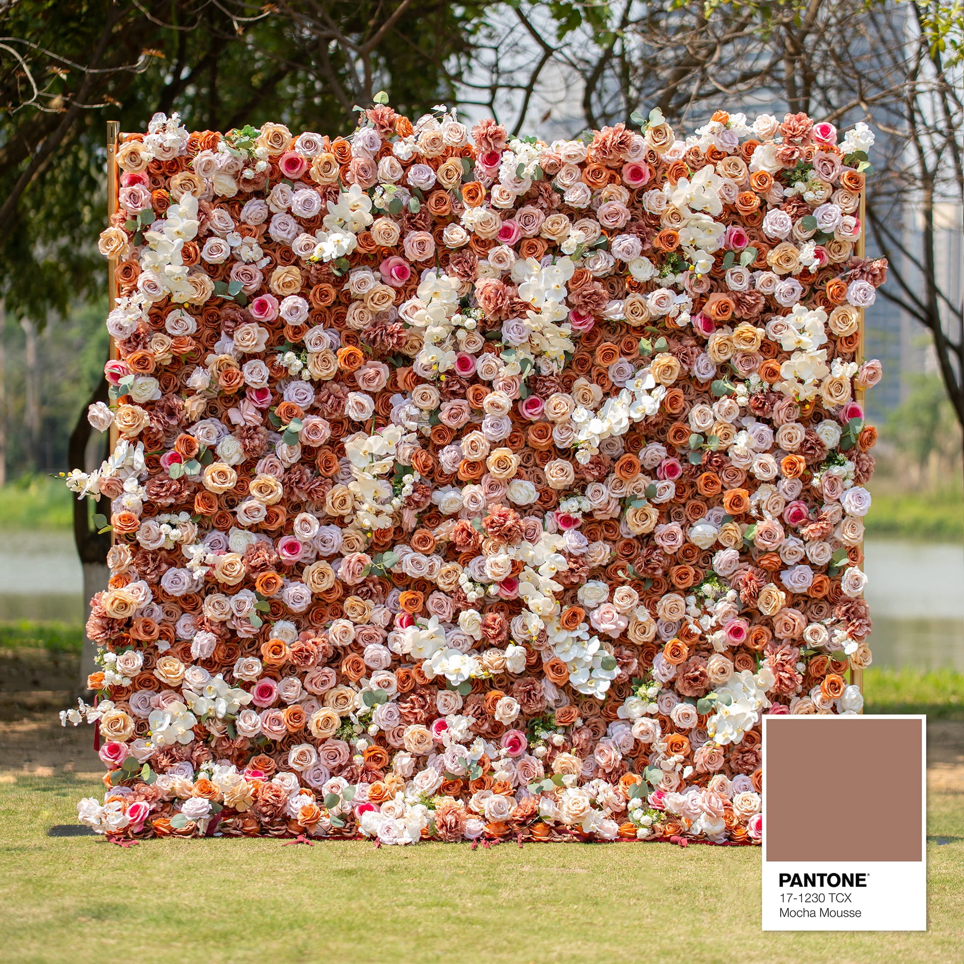 This backdrop features a warm, earthy theme color palette centered around shades of brown, beige, and white, with a Pantone reference of 17 - 1230 TCX (Mocha Mousse). It is densely filled with roses and orchids, perfect for elegant events like weddings or upscale garden parties. 
