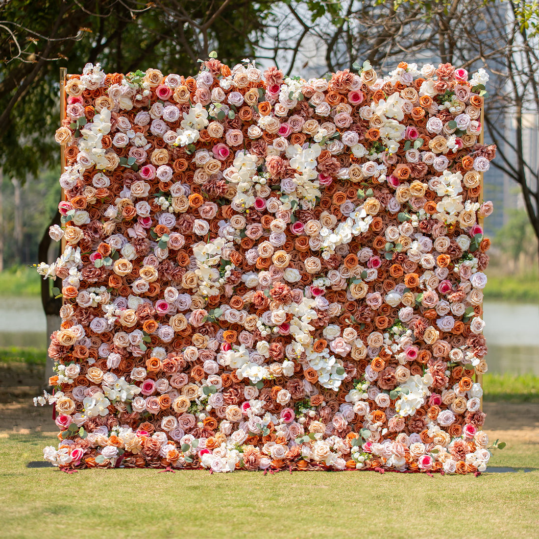 This backdrop exudes a warm, earthy charm with its theme colors of brown, beige, and white. Comprising roses and orchids, it creates a sophisticated look. Ideal for upscale events like weddings, corporate galas, or elegant garden parties.