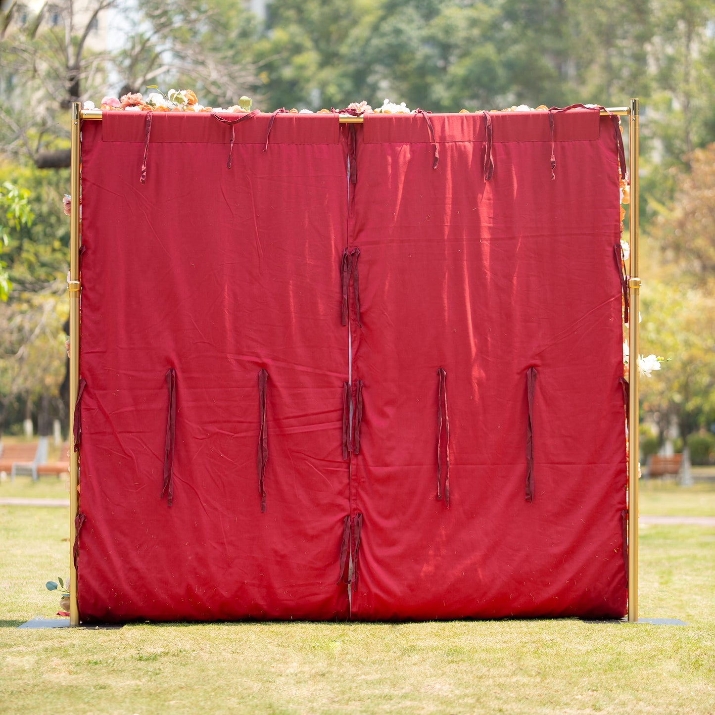 This backdrop features a rich, deep red fabric material, likely made of a durable textile. It has a solid color with a slightly wrinkled texture and tassel - like ties, giving it a classic and elegant look. Ideal for formal events such as weddings, galas, or upscale parties. 