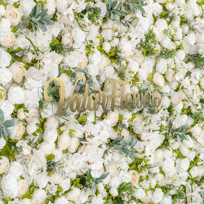 This backdrop is a lush arrangement of white roses, peonies, and orchids, interspersed with green foliage. With a monochromatic white and green color theme, it exudes elegance, making it perfect for weddings, galas, or upscale events. The “Valar Flowers” sign adds a touch of branding. 