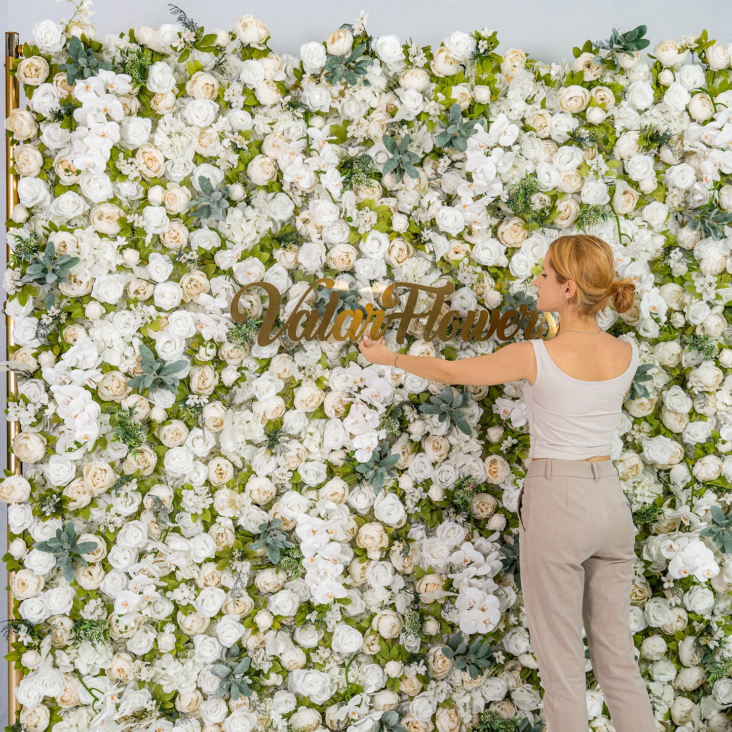 This backdrop features a lush arrangement of white roses, peonies, and orchids with green foliage. The white - green color theme exudes elegance, making it perfect for weddings, galas, or upscale events. The “Valar Flowers” sign adds a branded touch. 