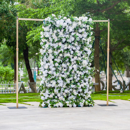This photo showcases a 4*8ft floral backdrop densely covered with white roses and tulips, interspersed with lush green foliage. Set against a park - like background, it exudes elegance. Ideal for events like a “White Grace” wedding or a sophisticated garden reception, it creates a refined and serene atmosphere for upscale outdoor celebrations. 