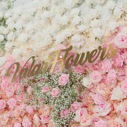 This stunning floral wall features white roses, baby’s breath, and soft pink blooms. The color theme—pure white to blush pink—creates a romantic, elegant vibe, perfect for weddings, bridal events, or upscale gatherings. The gold “ValarFlowers” sign adds sophistication, blending natural beauty with a polished aesthetic for memorable photo - worthy moments.