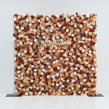 A large floral backdrop features an array of artificial flowers in shades of beige, white, and brown. At its center, “ValarFlowers” is written in gold script. The dense, varied blooms create a textured, elegant display, perfect for events or photo opportunities. 