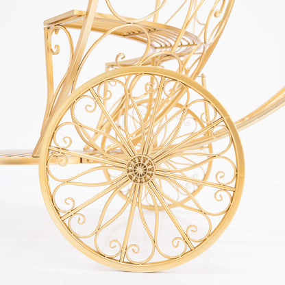 A close - up of a golden, ornate wheel from a Cinderella - style carriage. Intricate scrollwork and a decorative hub showcase elaborate wrought - iron design. The shimmering gold finish adds fairy - tale charm, perfect for themed displays. 