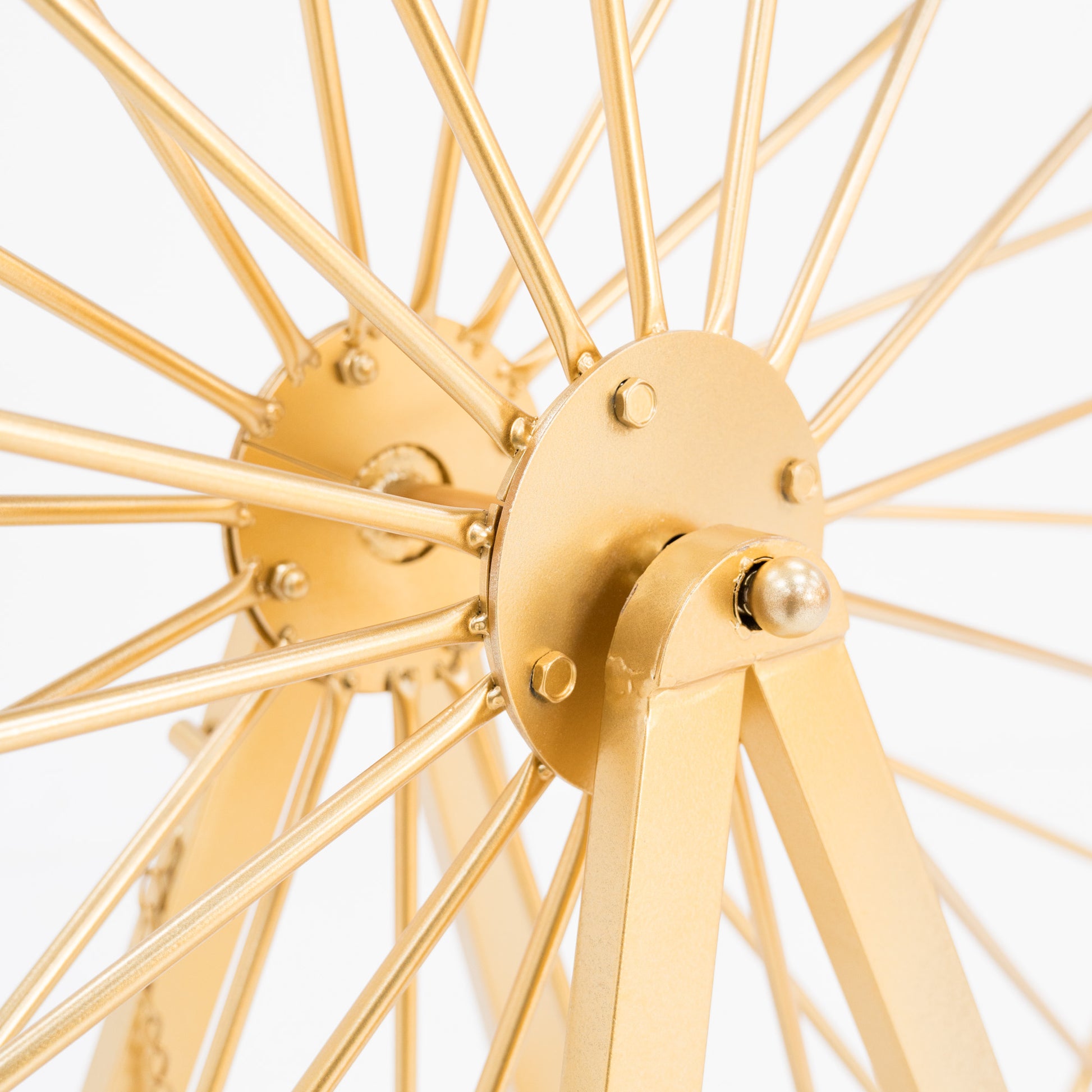Close - up of the central hub of a golden Ferris wheel decoration. Features metallic spokes, bolts, and a smooth, rounded pivot. The shimmering gold finish highlights the detailed, mechanical - like structure, showcasing craftsmanship. 