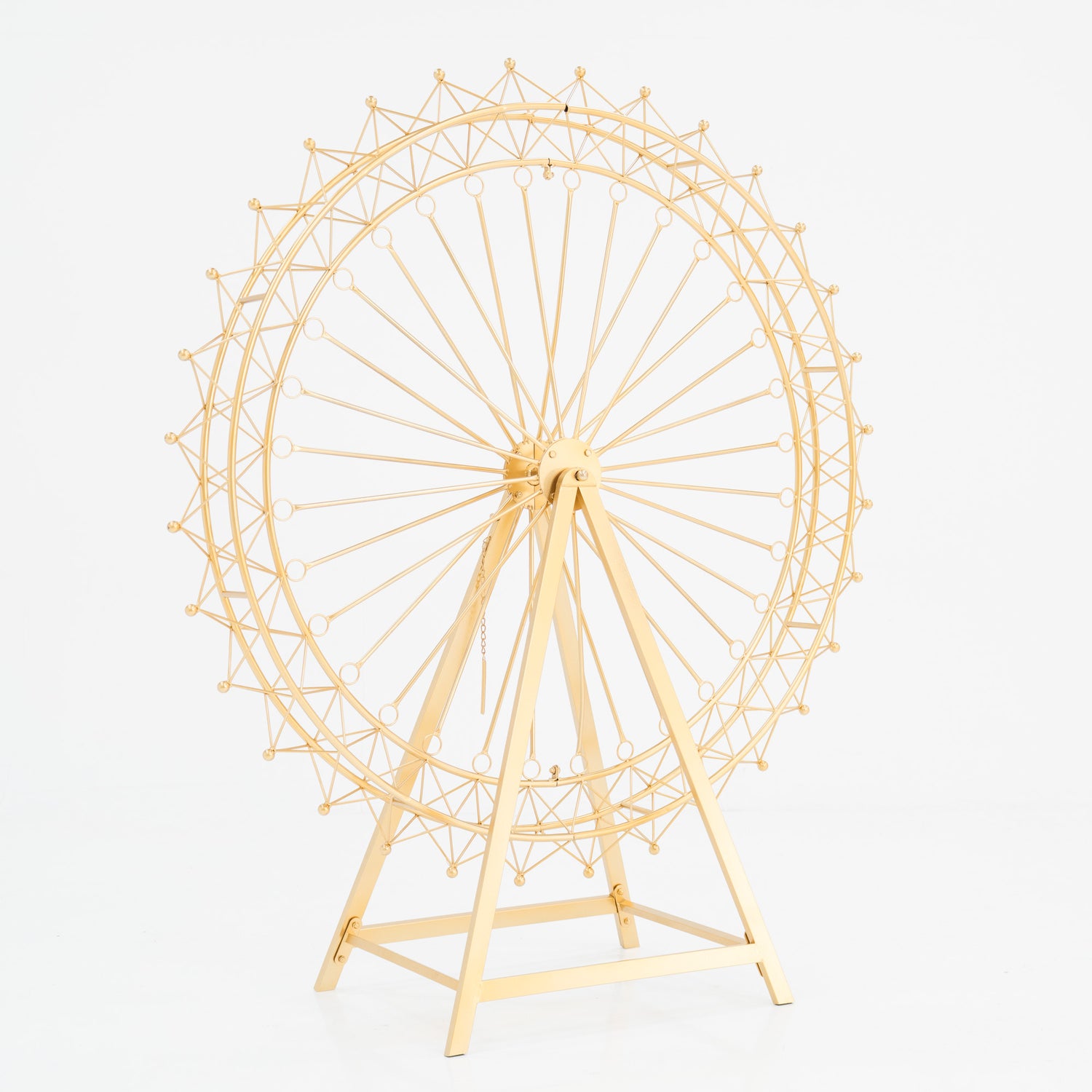 A golden metal Ferris wheel decoration with an open, intricate lattice design. It features a triangular stand and circular spokes, creating a delicate, ornamental structure. The shimmering gold finish adds elegance, perfect for decorative event setups. 