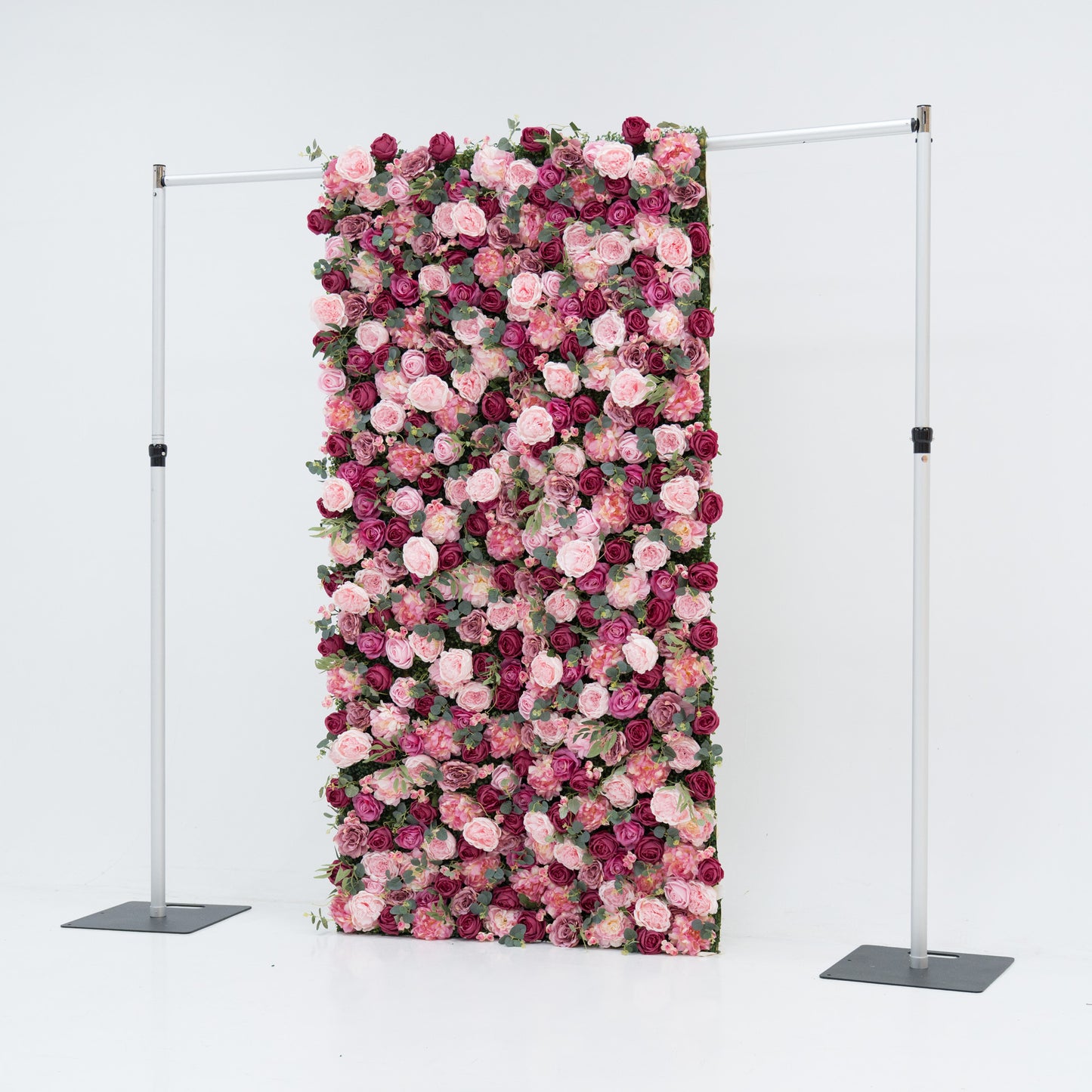 A 4x8ft artificial flower wall features a dense, vibrant mix of pink and deep - pink roses, interspersed with green foliage. Mounted on a metal frame, it creates an elegant, romantic backdrop—ideal for events, exuding charm and sophistication with lush, colorful blooms. 