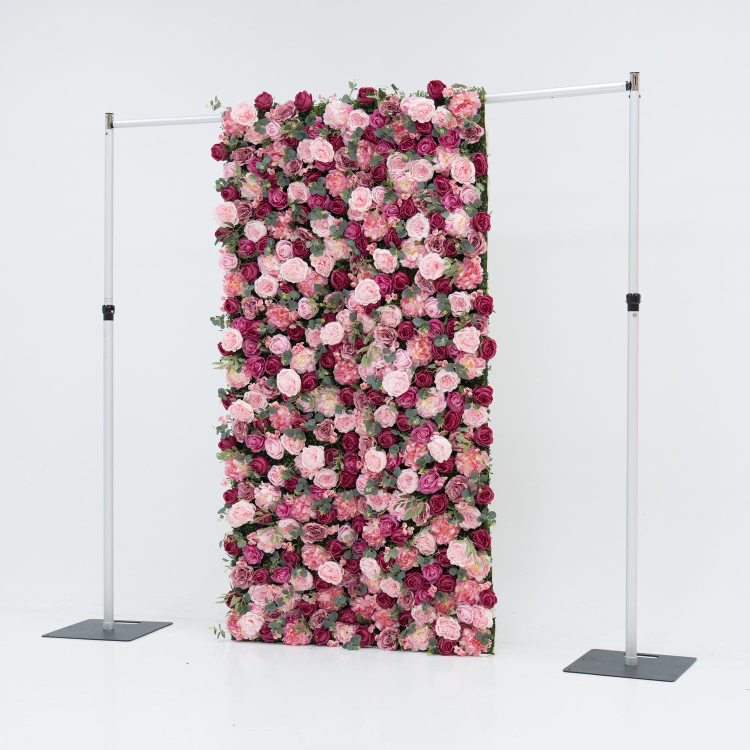 A 4x8ft artificial flower wall features a dense, vibrant mix of pink and deep - pink roses, interspersed with green foliage. Mounted on a metal frame, it creates an elegant, romantic backdrop—ideal for events, exuding charm and sophistication with lush, colorful blooms. 