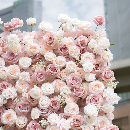 This Valar Flowers floral wall is a lush, romantic display of creamy white, soft blush, and dusty pink roses, interspersed with delicate baby&