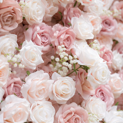 A close-up of a Valar Flowers floral wall, densely packed with a romantic blend of creamy white, soft blush, and dusty pink roses, interspersed with delicate white baby&
