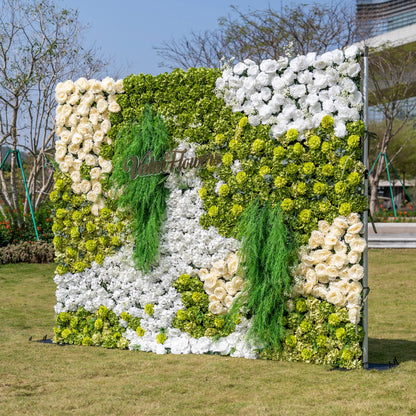 This is a premium nature-inspired artificial flower wall backdrop by Valar Flowers, featuring a lush, layered design with vibrant green hydrangeas, crisp white blooms, and soft ivory roses, accented by cascading green foliage. The custom "ValarFlowers" logo adds a personalized touch. This reusable, maintenance-free display creates a fresh, elegant focal point, ideal for outdoor weddings, garden parties, photo booths, and luxury events, offering long-lasting beauty for professional decor.