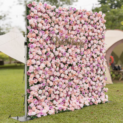 Close-up of Valar Flowers Sunset Romance flower wall highlighting multi-dimensional pink rose peony and hydrangea layers with soft lavender accents and blurred outdoor backdrop for luxury bridal showers and sophisticated event photography
