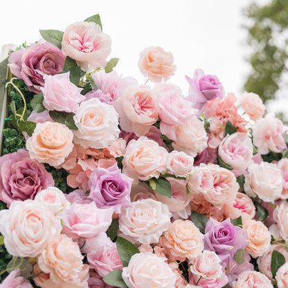 Intimate close-up of Valar Flowers Sunset Romance silk rose peony and hydrangea wall in dusty pink soft peach and creamy ivory with subtle lavender accents bright natural light for baby showers engagement parties and elegant milestone celebrations