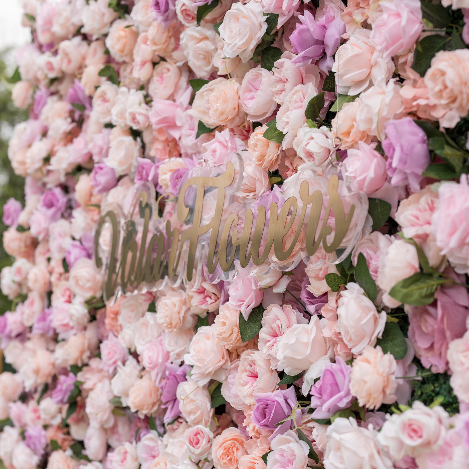 Elevated close-up of Valar Flowers Sunset Romance wall with dense 3D arrangement of roses peonies and hydrangeas in pink peach cream and lavender tones evoking an enchanting sunset garden for spring celebrations outdoor boho weddings and whimsical photo booths