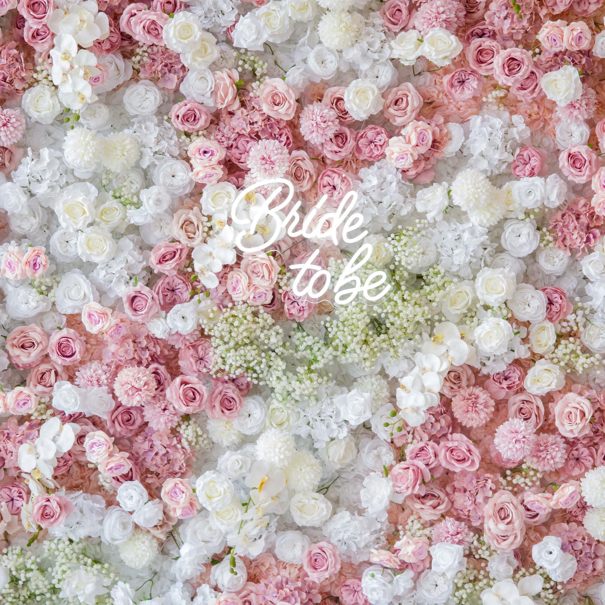 This backdrop is a floral wonderland, densely packed with artificial flowers. It features roses in soft pinks and whites, along with white orchids and clusters of baby's breath. The color palette is pastel - heavy, with gentle pinks and pure whites creating a romantic and dreamy style. The "Bride to be"  text adds a celebratory touch, perfect for bridal events. 