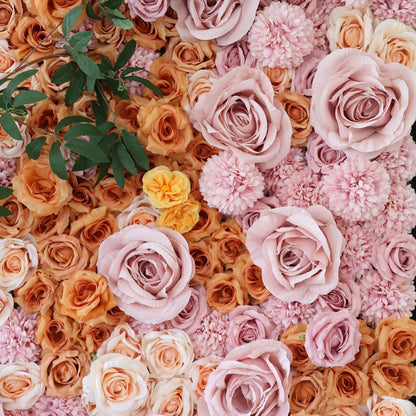 This image showcases a beautiful floral arrangement by Valar Flowers. It features a dense cluster of artificial roses in soft, romantic hues—pale pink, peach, and subtle orange—along with other complementary blooms. The flowers are intricately arranged, creating a lush, textured, and visually appealing display that exudes elegance and charm, perfect for adding a touch of sophistication to events or spaces.
