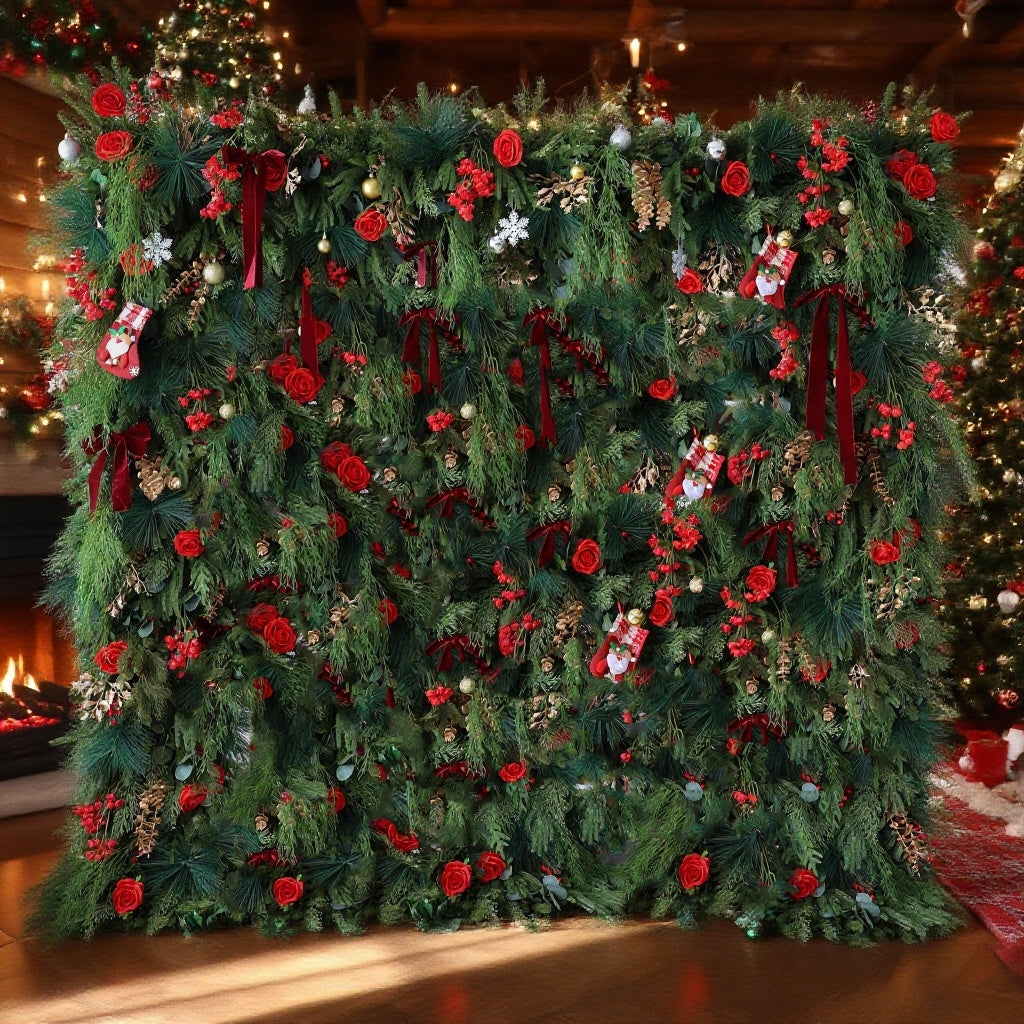 This image showcases a large, festive Christmas - themed floral wall. It is densely decorated with lush green foliage, vibrant red roses, and various Christmas ornaments like small stockings, snowflakes, and baubles. Deep red ribbons add to the holiday charm. Set in a cozy indoor space with a lit fireplace and a decorated Christmas tree in the background, the wall exudes a warm and joyful Christmas atmosphere, perfect for holiday celebrations.