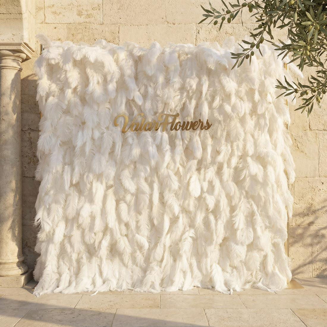 This Valar Flowers white feather wall backdrop is a luxe, ethereal piece crafted from soft, cascading ivory feathers, creating a plush, cloud-like texture. Adorned with a custom gold brand sign, it’s ideal for weddings, bridal showers, and high-end photo ops, offering a dreamy, elegant focal point that blends romance and sophistication.