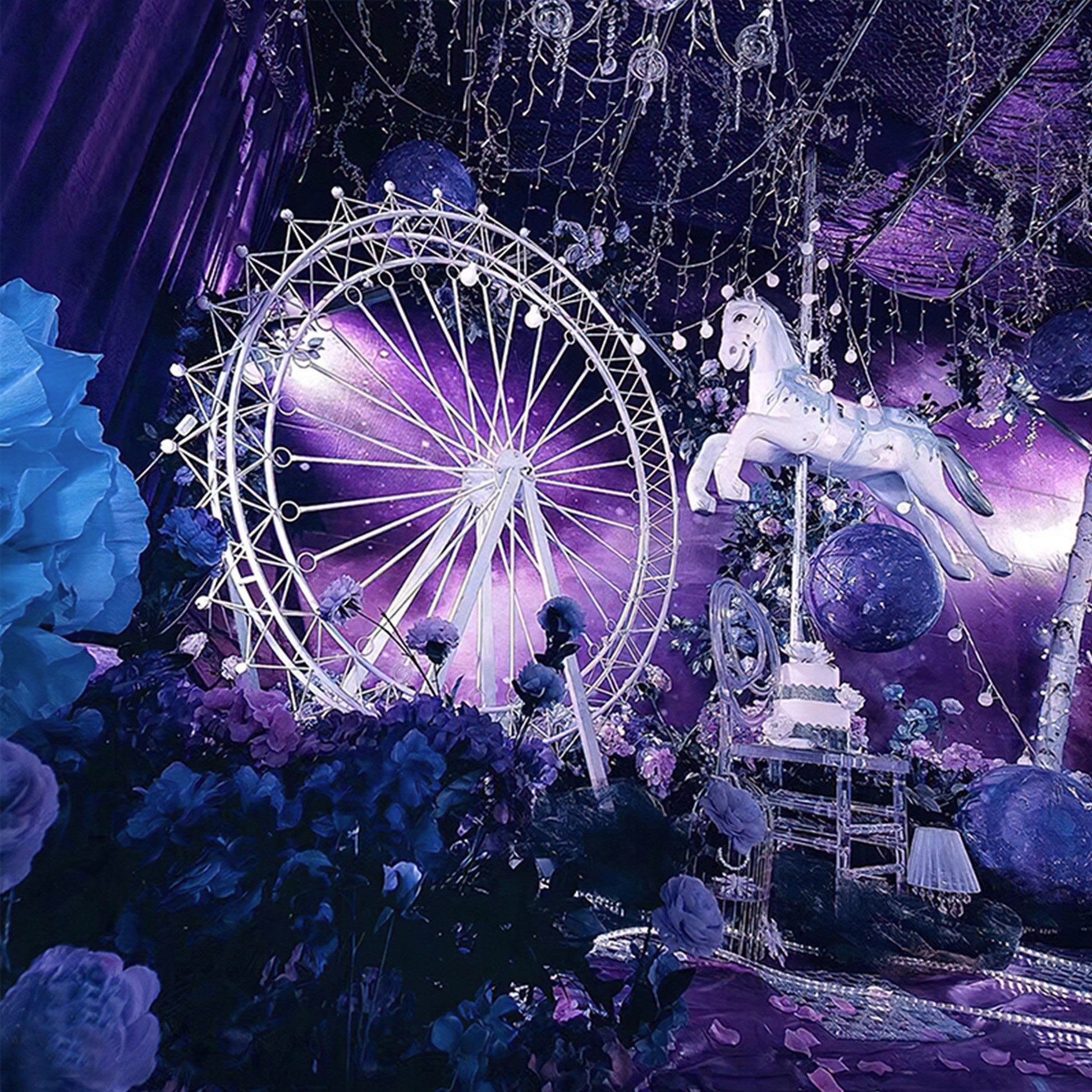 A dreamy,  fancy purple - hued event scene features a white Ferris wheel and a carousel horse. Lush blue and purple flowers, hanging decor, and glowing orbs create a magical, fairy - tale atmosphere, perfect for a whimsical celebration. 