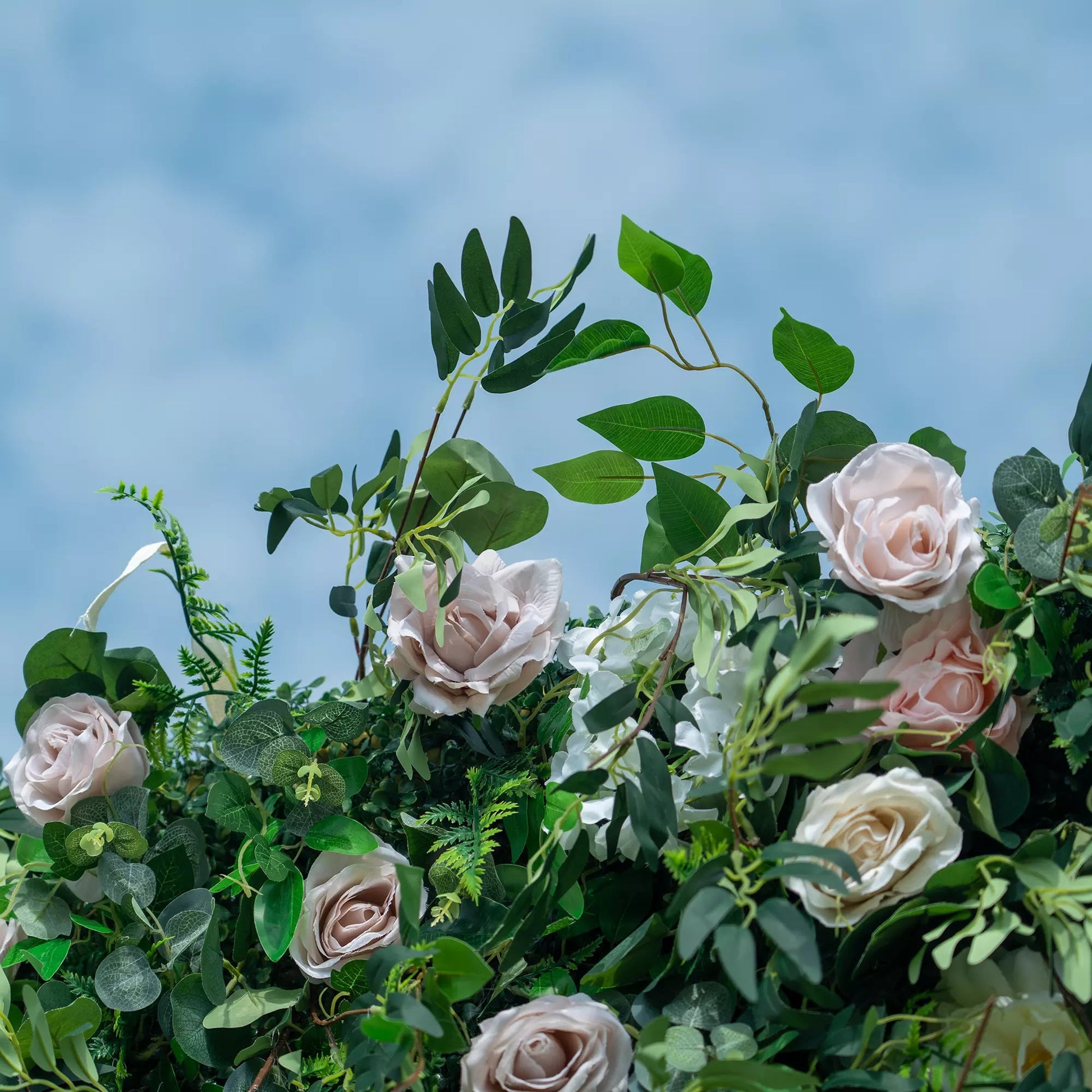 Valar Flowers 3D green lush and deluxe floral wall featuring a premium arrangement of dense silk roses, artificial ferns, and mixed greenery in rich emerald and forest green tones, perfect for garden-themed weddings, events, and stunning photo backdrops.
