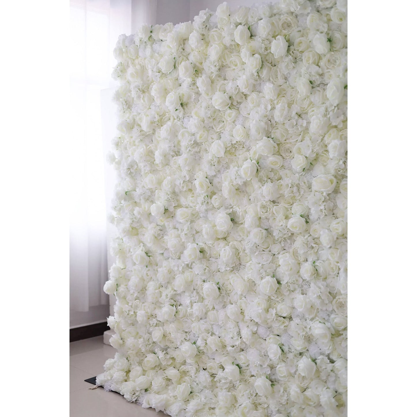 Valar Flowers premium all-white artificial flower wall backdrop featuring a dense arrangement of lush silk roses, hydrangeas, and carnations in an elegant monochromatic ivory palette, perfect for luxury wedding decor and event photo booth backgrounds.