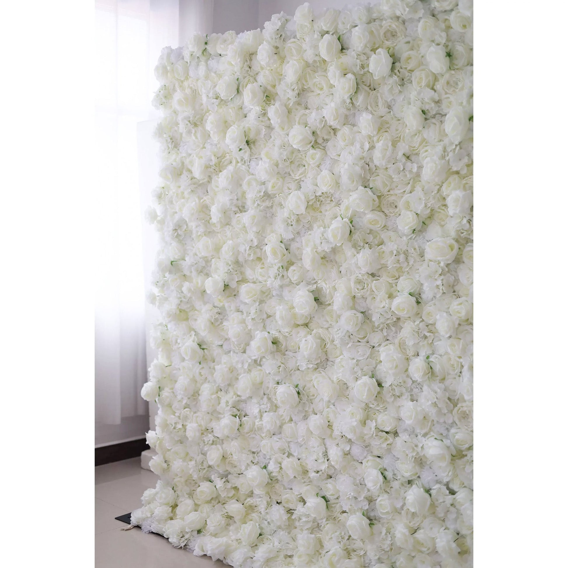 Valar Flowers premium all-white artificial flower wall backdrop featuring a dense arrangement of lush silk roses, hydrangeas, and carnations in an elegant monochromatic ivory palette, perfect for luxury wedding decor and event photo booth backgrounds.