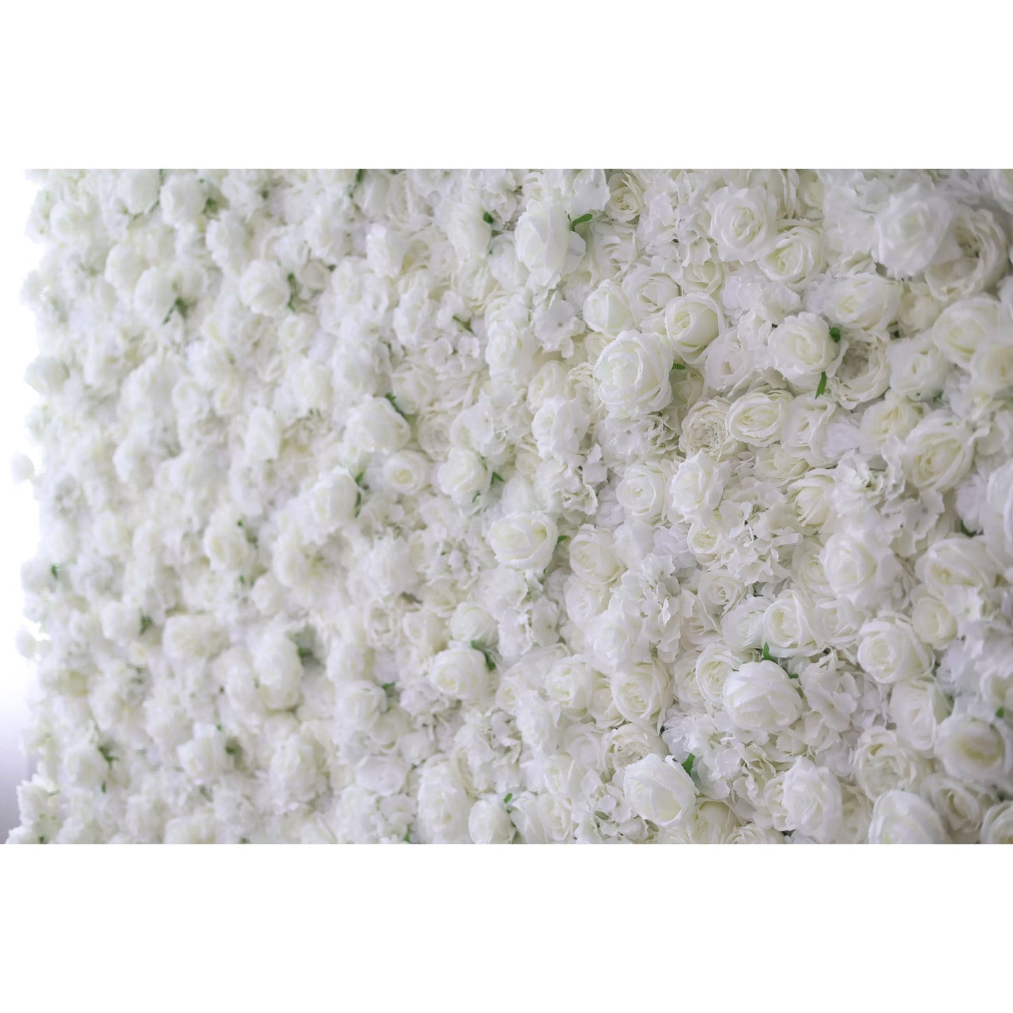 Valar Flowers premium all-white artificial flower wall backdrop featuring a dense arrangement of lush silk roses, hydrangeas, and carnations in an elegant monochromatic ivory palette, perfect for luxury wedding decor and event photo booth backgrounds.