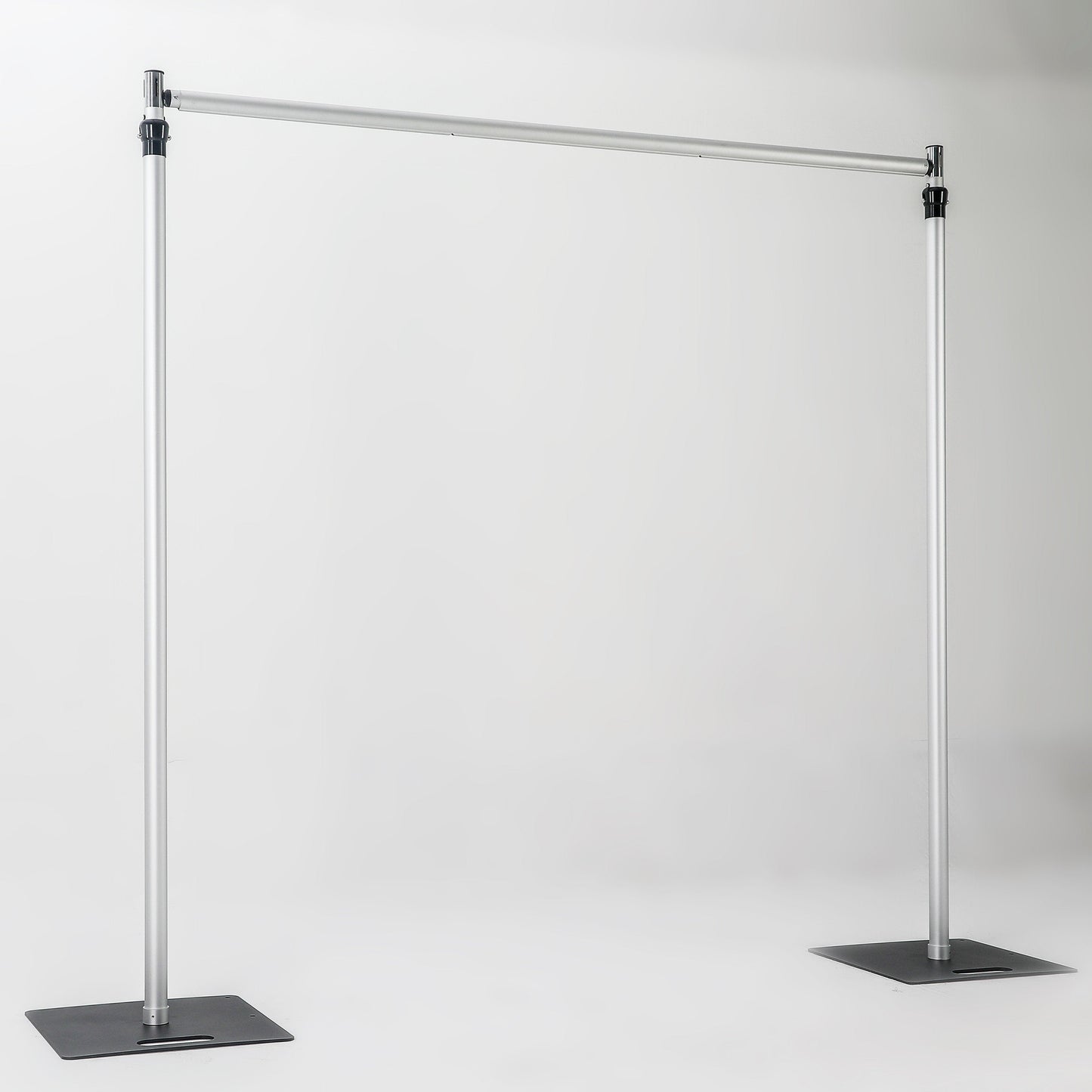 The image depicts a metallic bar structure with two vertical stand bars connected by a horizontal cross bar, each stand bar resting on a square iron base. It has a simple, industrial - looking design. 