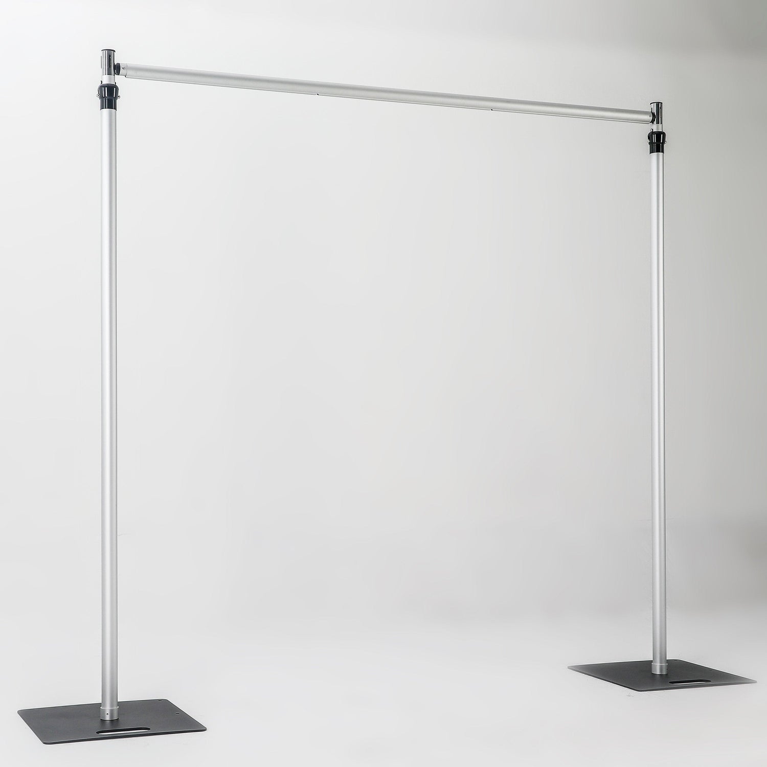 The image depicts a metallic bar structure with two vertical stand bars connected by a horizontal cross bar, each stand bar resting on a square iron base. It has a simple, industrial - looking design. 