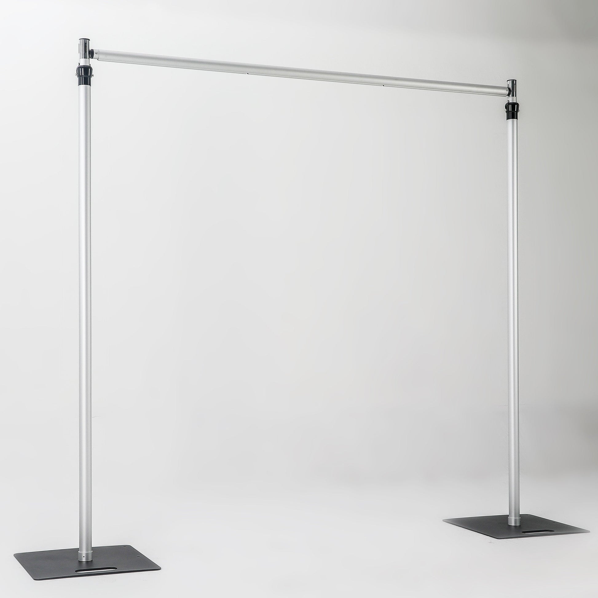 The image depicts a metallic bar structure with two vertical stand bars connected by a horizontal cross bar, each stand bar resting on a square iron base. It has a simple, industrial - looking design. 