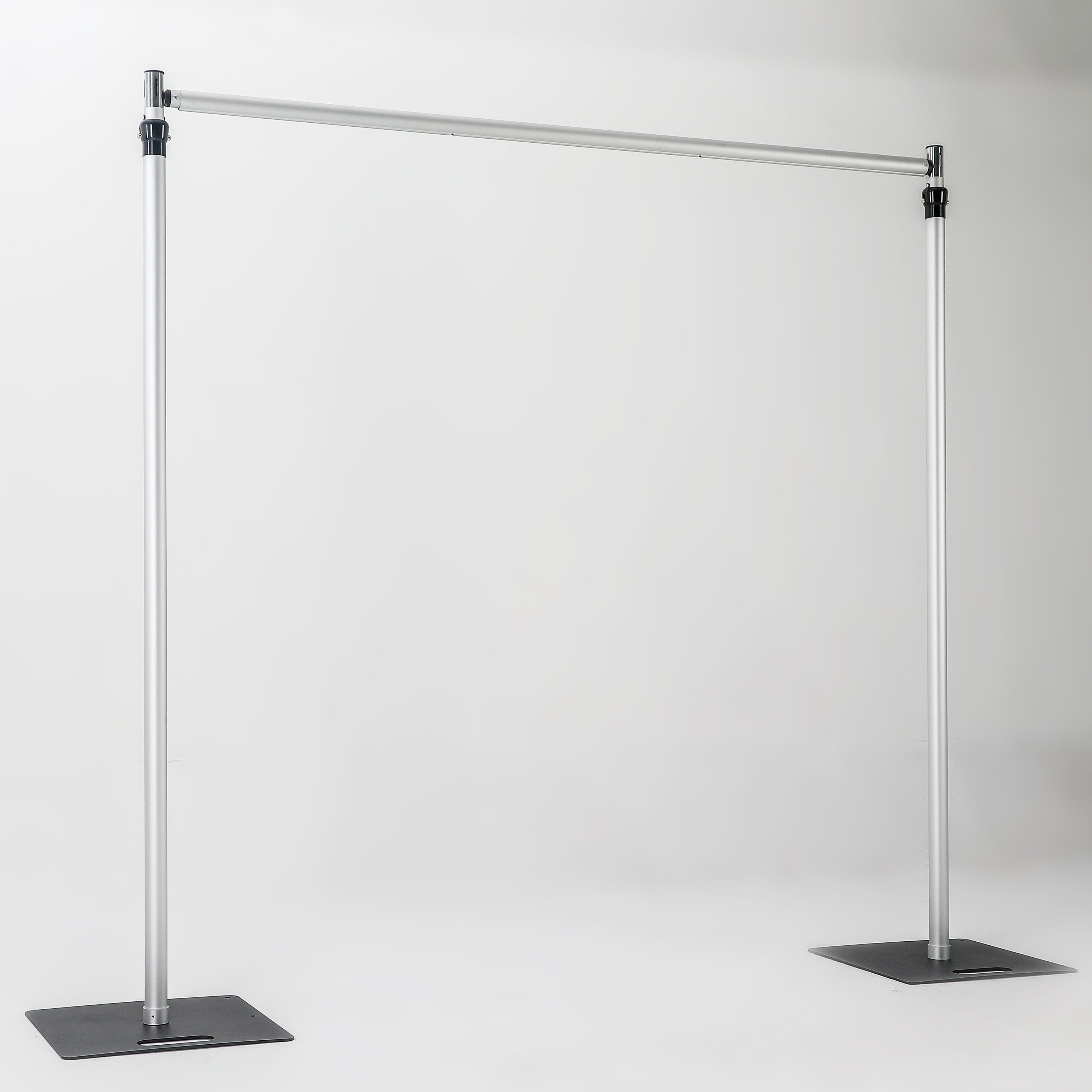 The image depicts a metallic bar structure with two vertical stand bars connected by a horizontal cross bar, each stand bar resting on a square iron base. It has a simple, industrial - looking design. 
