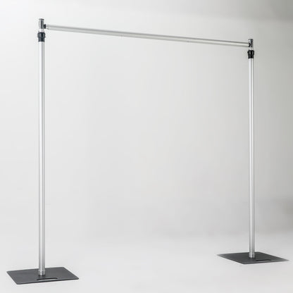The image depicts a metallic bar structure with two vertical stand bars connected by a horizontal cross bar, each stand bar resting on a square iron base. It has a simple, industrial - looking design. 