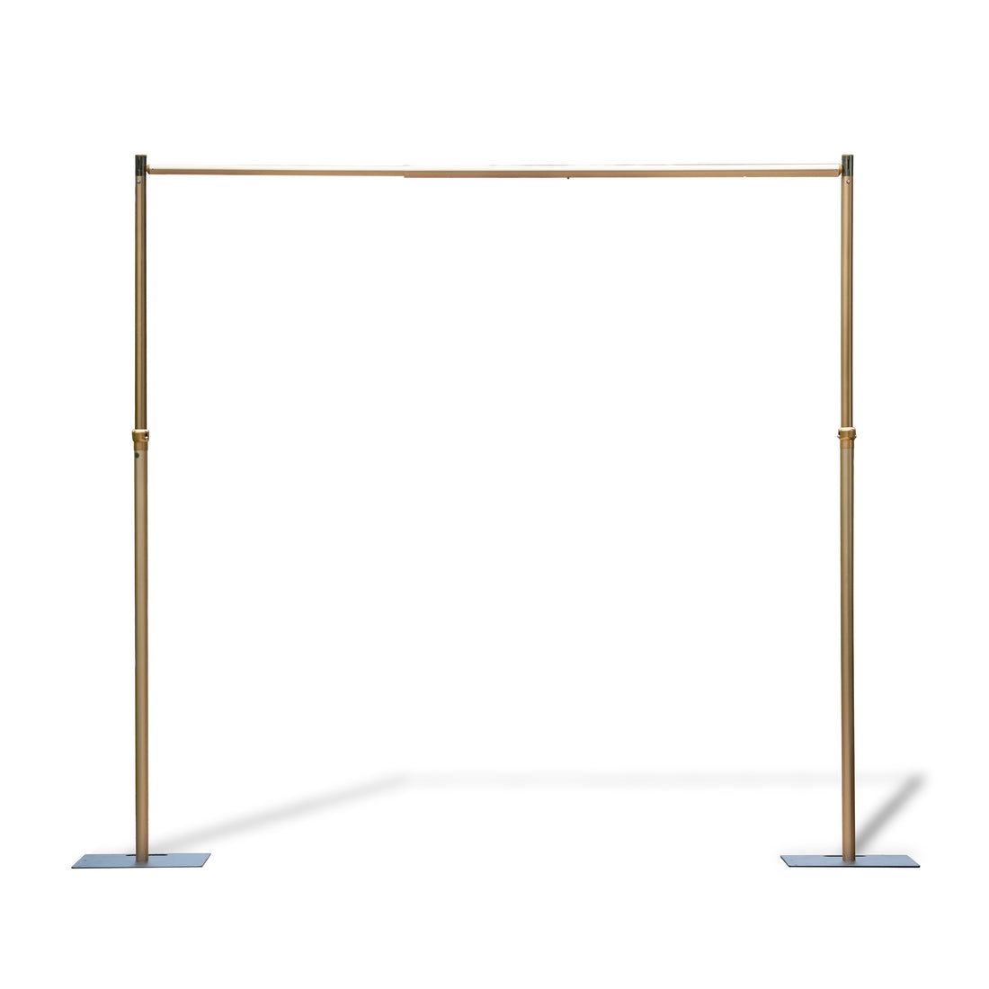 This image features an adjustable - size golden backdrop stand. It consists of two vertical poles connected by a horizontal bar at the top. The vertical poles have adjustable sections, indicated by the presence of connectors, which allow for height modification. The stand is supported by flat, rectangular base plates, providing stability. The golden finish gives it an elegant appearance, making it suitable for events like weddings or photography setups.