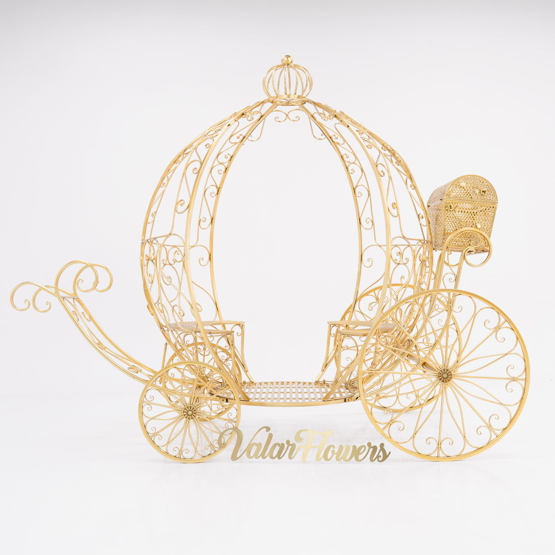 A 7.9ft life - size, Disney - style Cinderella’s fantasy pumpkin carriage. Crafted from gold - toned, ornate wrought iron with intricate scrollwork. Features a curved, open - air design, large decorative wheels, and a small attached compartment. “ValarFlowers” adds a branded touch, perfect for fairy - tale - themed events. 