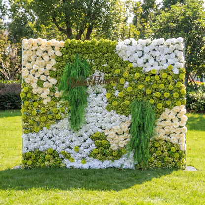 This is a premium green and white artificial flower wall backdrop by Valar Flowers, featuring a lush, nature-inspired design with vibrant green hydrangeas, ivory roses, white blooms, and cascading green foliage. With the brand’s custom logo sign, this reusable, maintenance-free floral display creates a fresh, elegant focal point, ideal for outdoor weddings, garden parties, photo booths, and luxury event styling, offering a long-lasting, nature-themed aesthetic for professional decor.